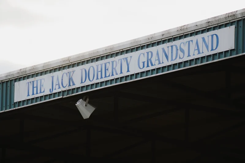 a sign on the side of a building that says jack dory grandstand