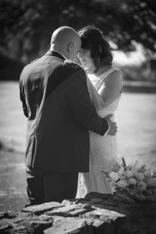 Couple sharing a quiet moment during their Northern Ireland outdoor wedding ceremony.