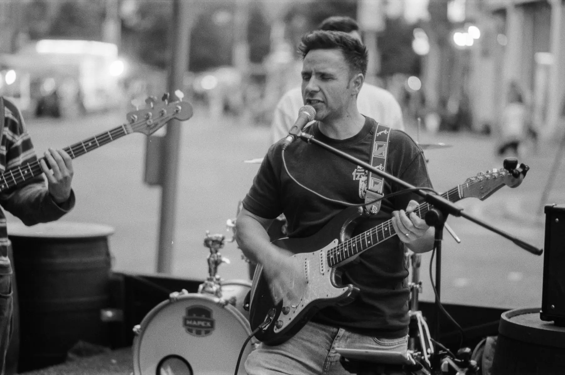 A guitarist and singer performing at Belfast Fleadh.